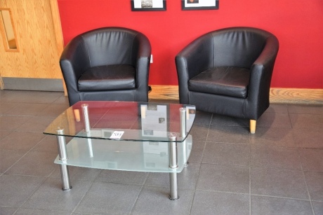 2 Black leather effect tub chairs and a chrome and glass coffee table (Reception)