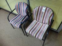2x multi colour steel framed arm chairs
