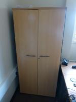 Furniture to private office 1 to include, 1800 mm x 1200 mm beech effect workstation with three draw pedestal, 1.7 m high beech effect double door cupboard, 730 mm high beech effect double door cupboard, Vickers brown/cream steel 4 draw filing cabinet, bl - 3